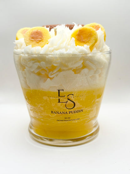 Banana pudding in a glass container with 'ES' branding on a white background
